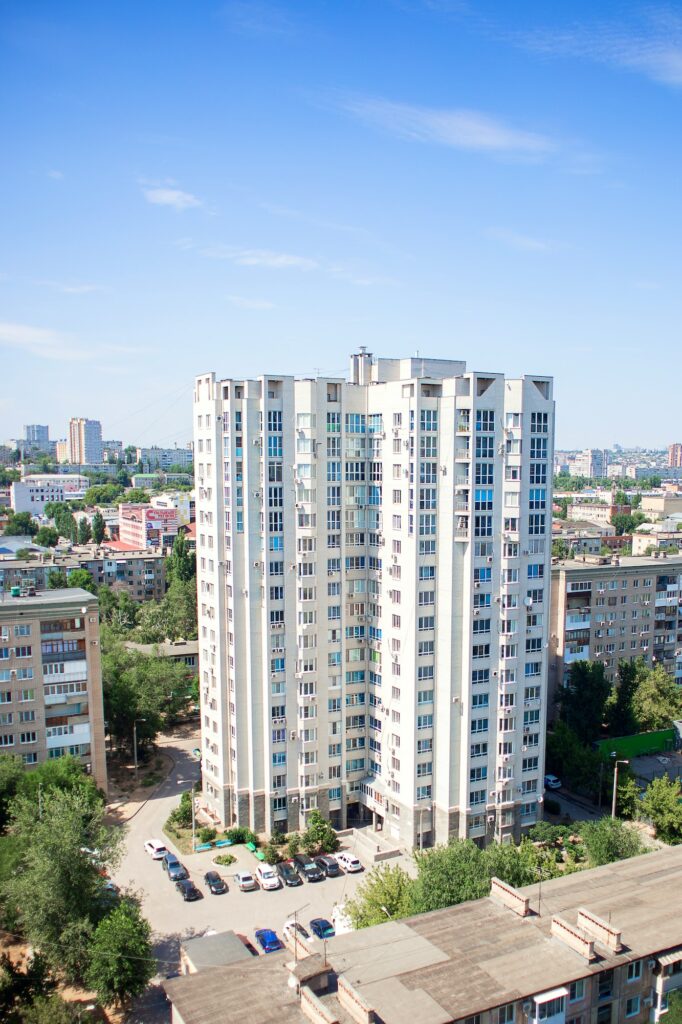 High-rise residential building new building in a large city among small five-story buildings